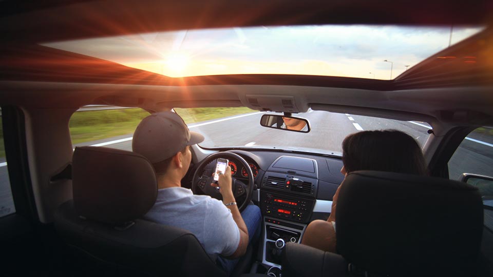 Couple driving in car